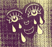 a black heart-shaped cartoon face printed on yellow paper that is both smiling and crying, with a plaid background